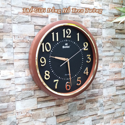 Đồng Hồ NHẠC CHUÔNG Báo Giờ Có 16 Điệu NHẠC GÕ Báo Giờ - Máy Kim Trôi EASTAR Nhật - Số nổi 3D Viền Nâu Mặt Đen – Tặng Pin Maxell - Bảo Hành 1 Năm