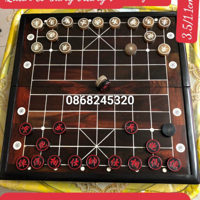 Combo bộ bàn cờ tướng gỗ trắc kt 50×50×3cm + quân cờ sừng trắng đen kt 3.5×1.2cm 