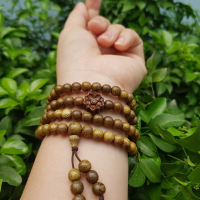 Vòng đeo tay nữ gỗ trầm mix bông hoa sen kiểu quấn tay 4 vòng may mắn tài lộc  Size hạt 6mm  Màu vàng nâu vân sáng nhẹ đeo tay rất đẹp xinh mùi thơm nhẹ nhẹ ạ